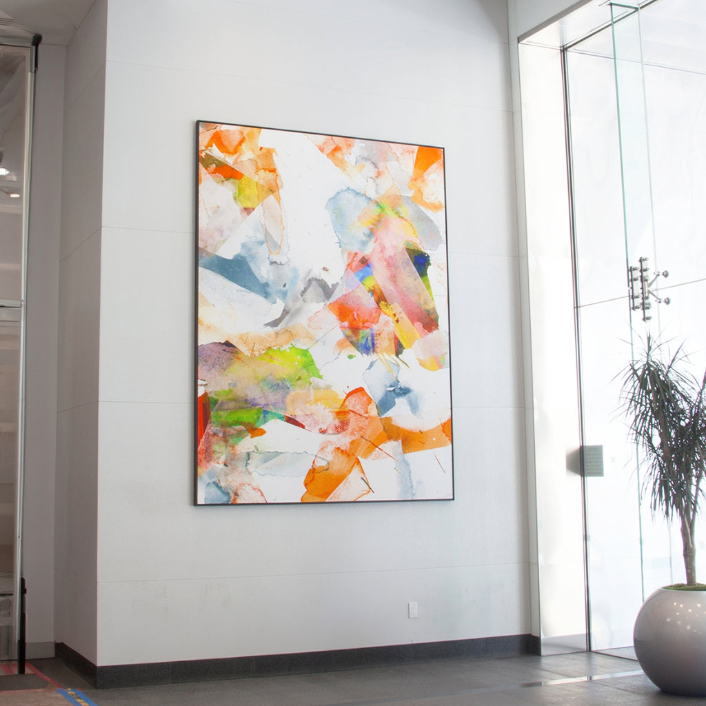 Contemporary office lobby with a vibrant, colorful abstract painting by WRAPPED Studio, highlighting a fresh and dynamic approach to corporate art.