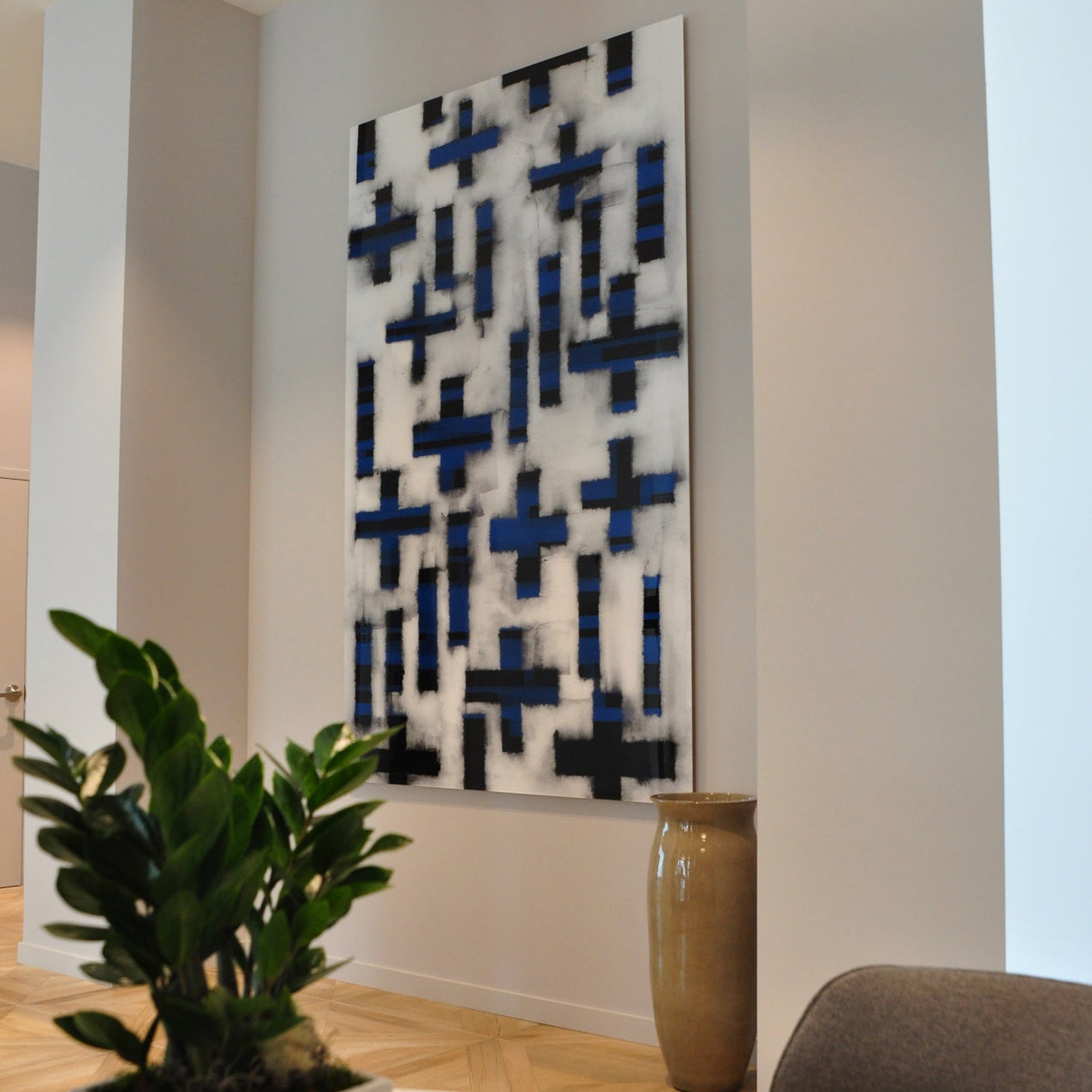 Contemporary 465 North Park lobby featuring a blue and black abstract painting by WRAPPED Studio, elevating the space with its artistic flair.