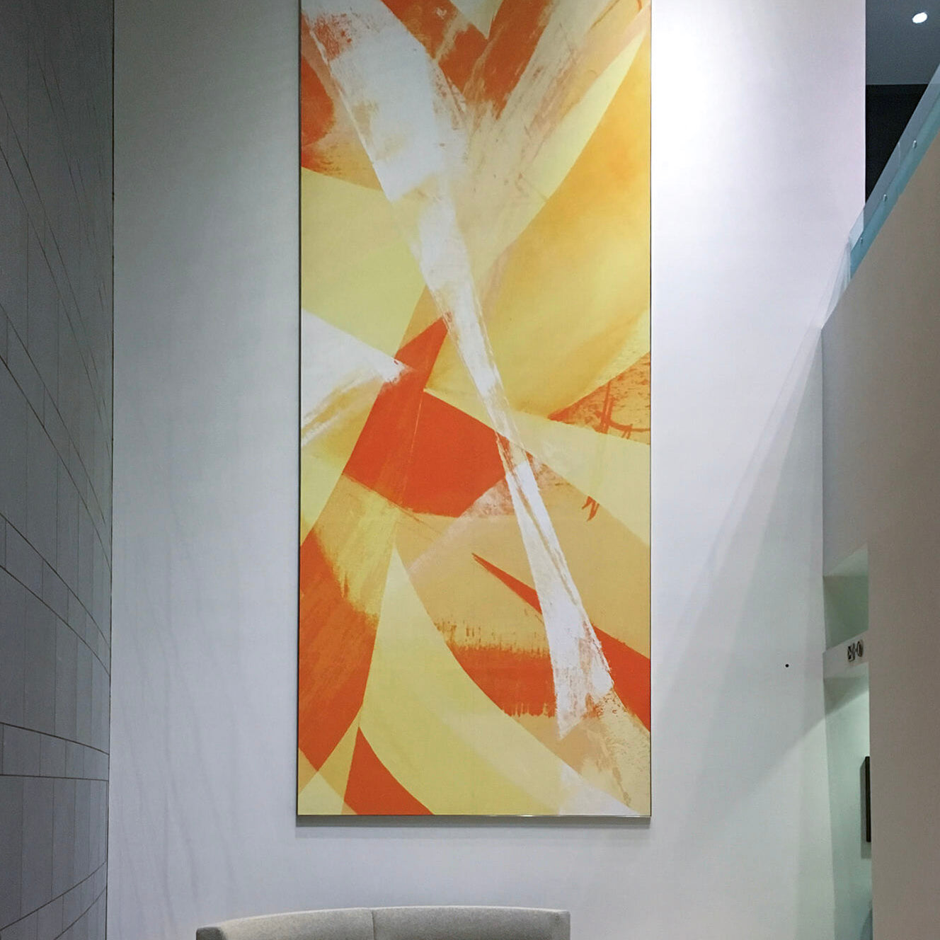 Spacious lobby at 71 South Wacker Drive adorned with a vibrant abstract painting from WRAPPED Studio.