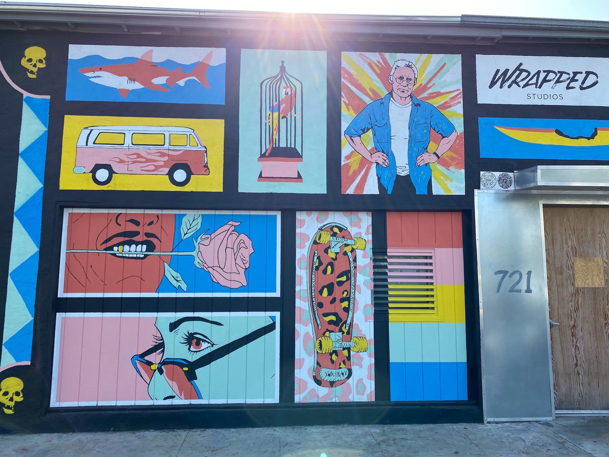 WRAPPED Studio's mural at Arnoldi's studio capturing Venice's skateboarding legacy and beach culture, featuring a shark and a vibrant skateboard design.