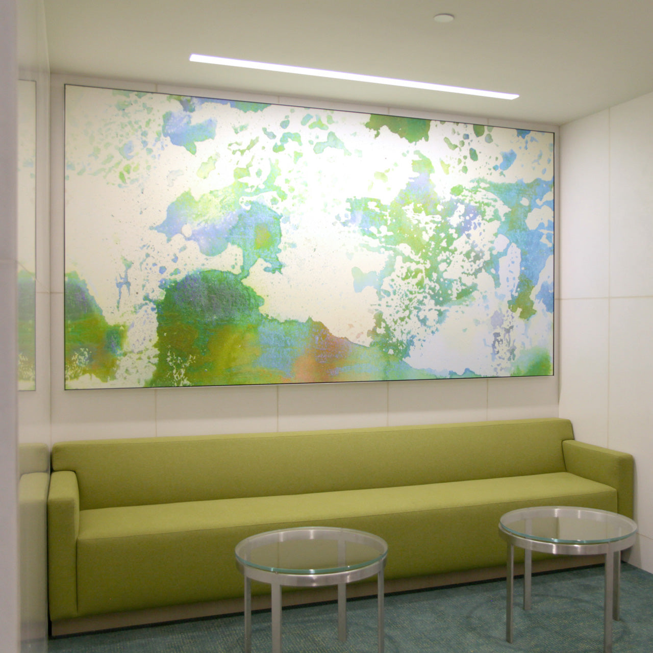 Custom large-format canvas with green color splashes by WRAPPED Studio in the Jamboree Center offices.
