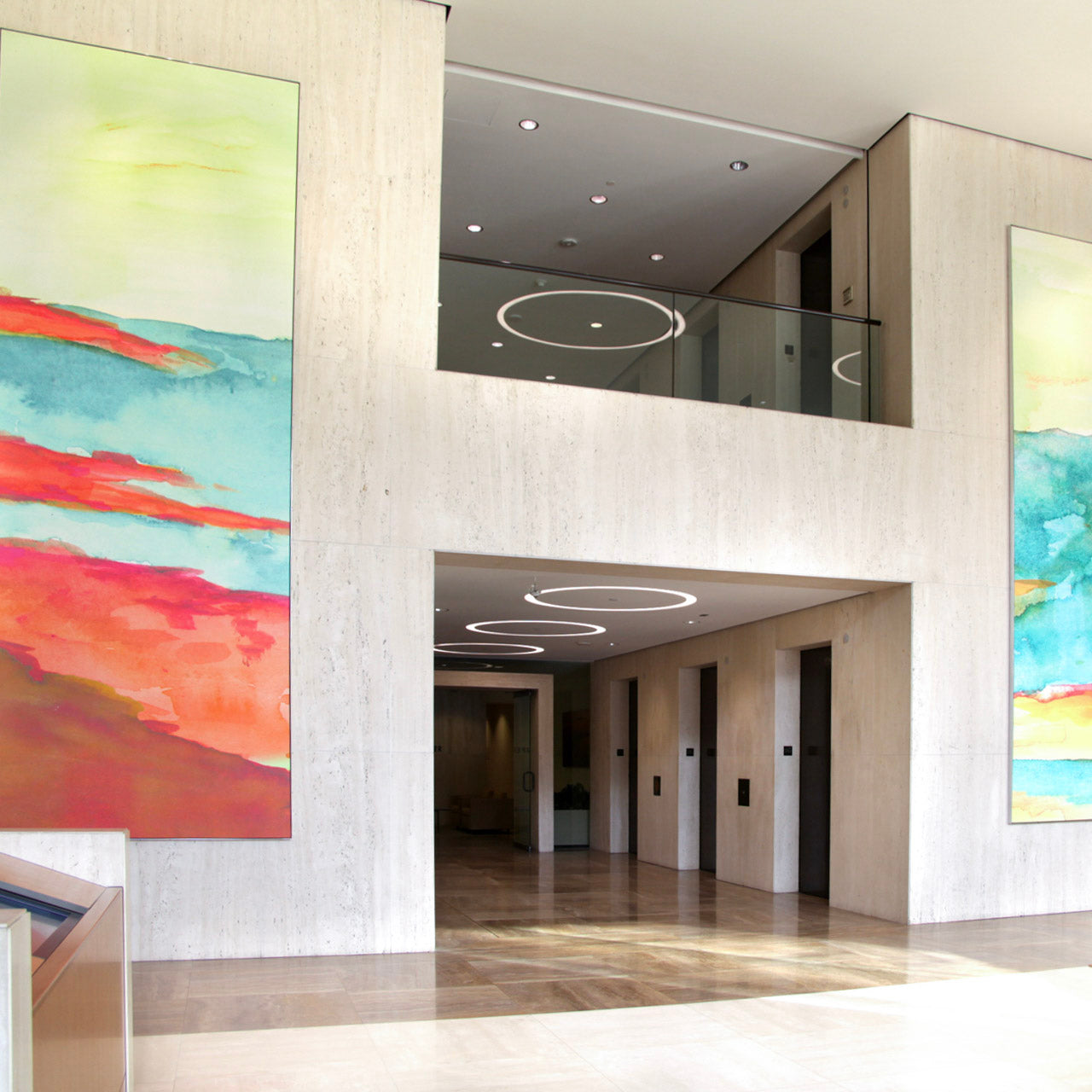 Custom large-format canvases with warm and inviting colors in Jamboree Center's office lobby curated by WRAPPED Studio