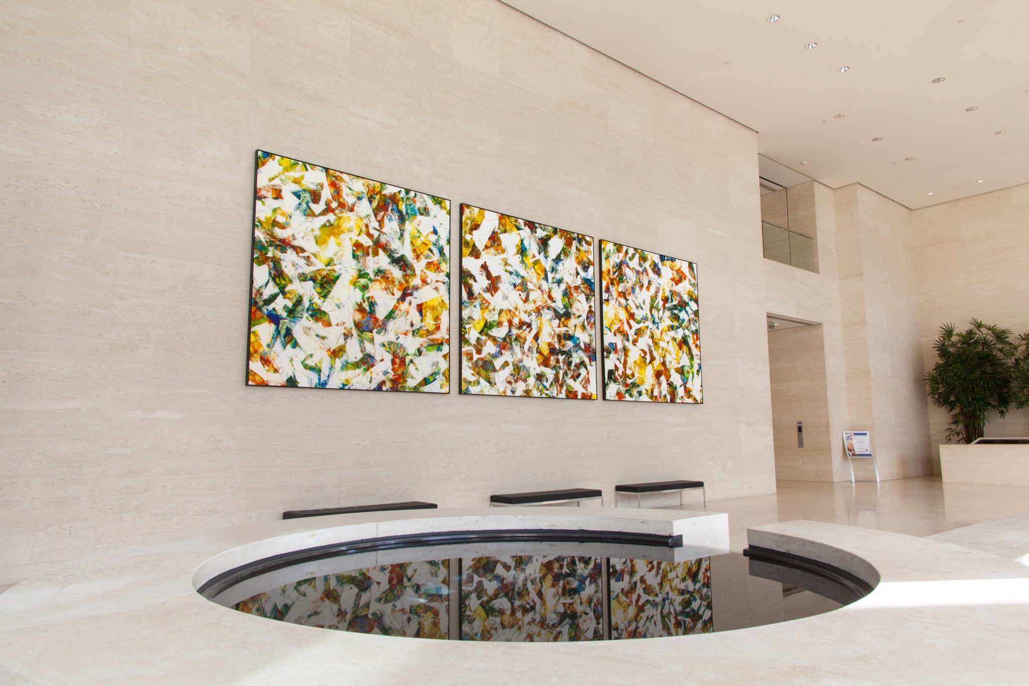 Custom large-format canvas art created by WRAPPED Studio for MacArthur Court office lobby, inspired by Newport's natural beauty, accentuating the lobby's modern elegance.