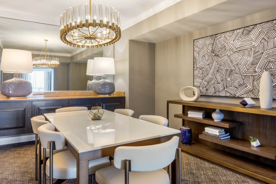 Black and white abstract canvas with geometric leaf-like forms by WRAPPED Studio, custom-created for Omni Hotels to complement a refined interior.