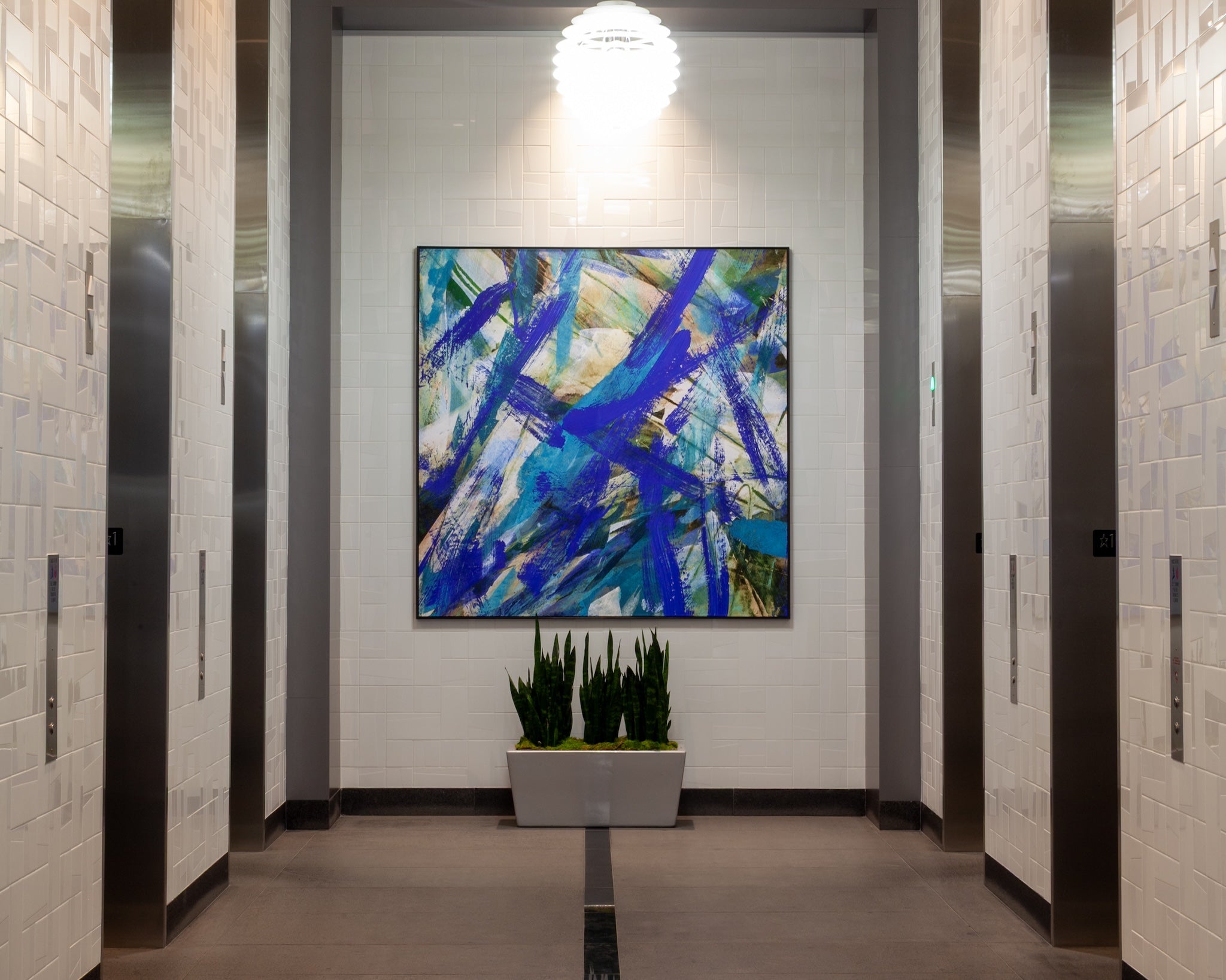 Custom abstract painting by WRAPPED Studio installed in the elevator lobby of 177 East Colorado.