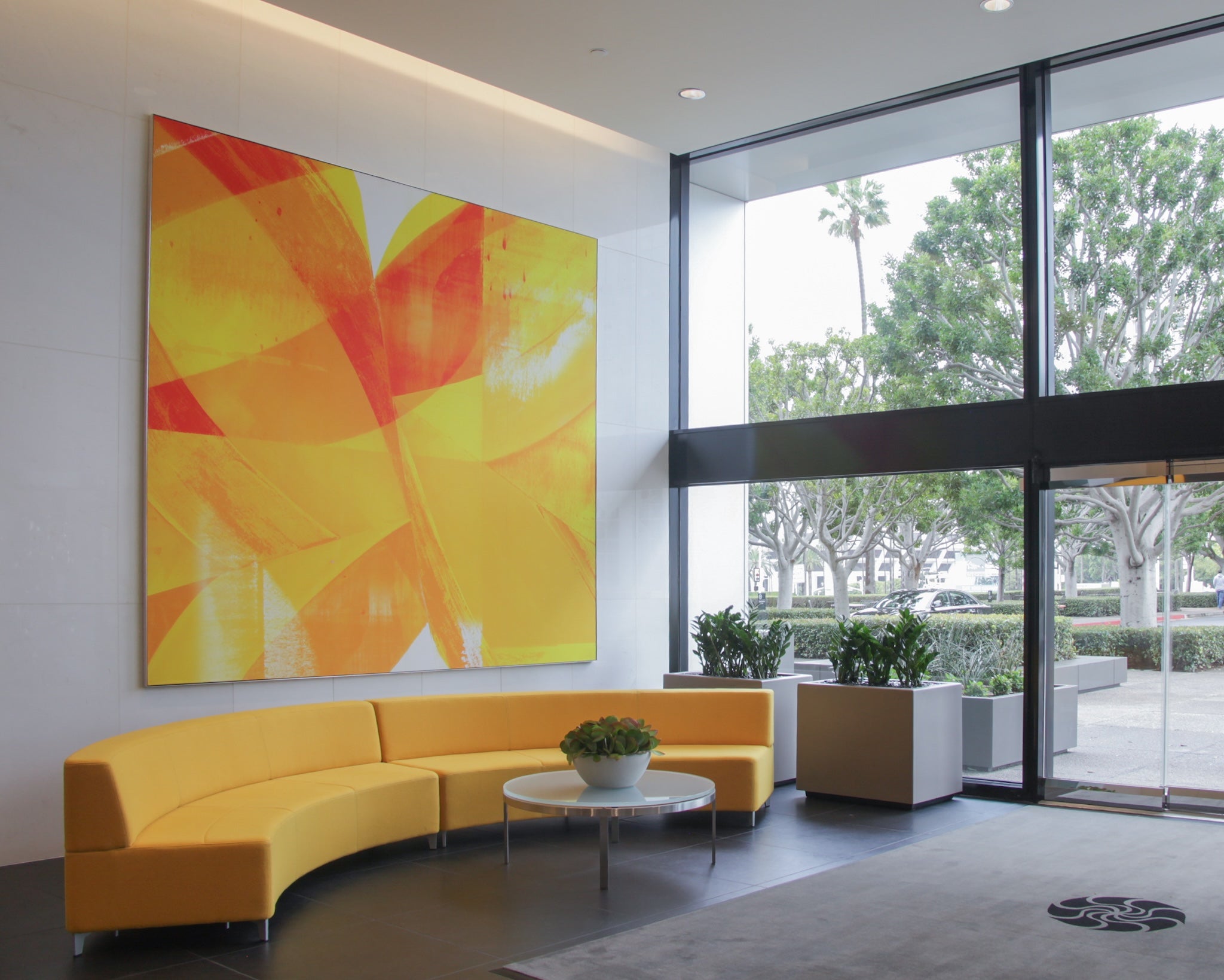 Large custom abstract canvas artwork by WRAPPED Studio, installed in the corporate lobby at 600 Newport Center.