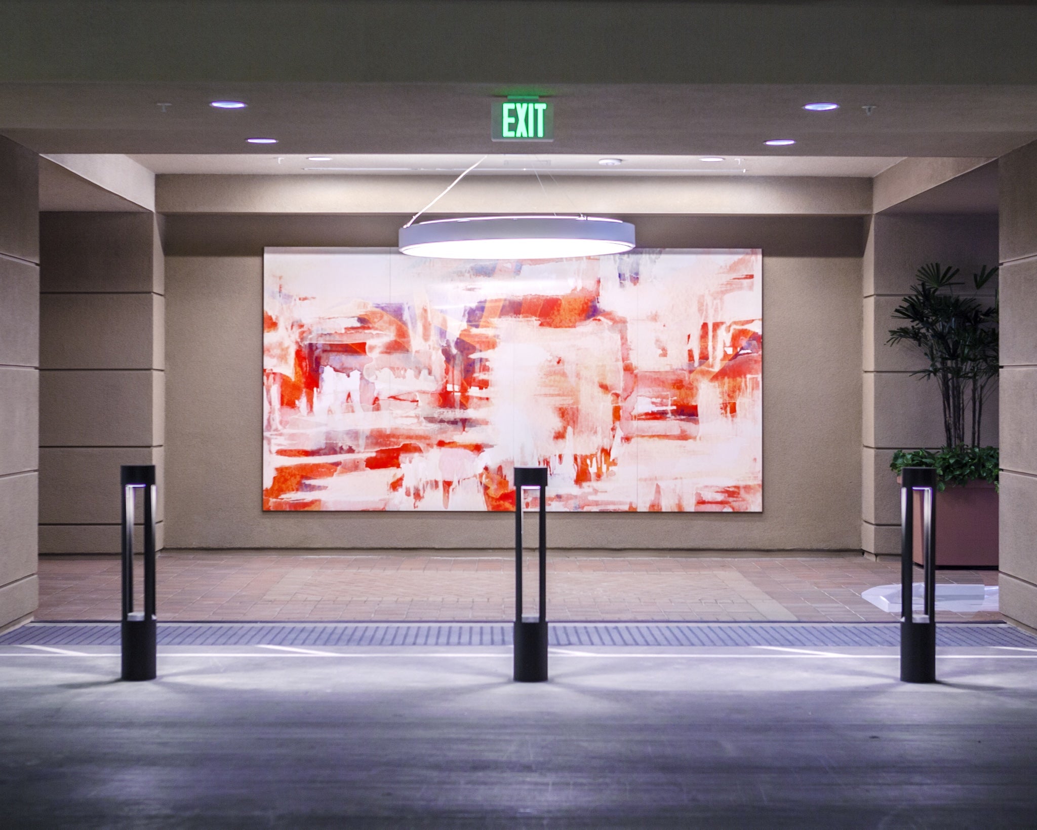Large-scale custom artwork by WRAPPED Studio installed at the exterior lobby of Centerpointe.