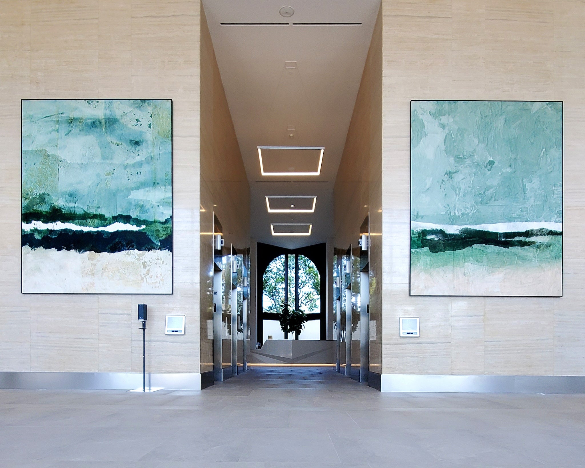 Custom two-panel lobby artwork installation by WRAPPED Studio at City Plaza, a commercial office property managed by Irvine Company.