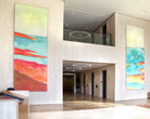 Custom large-format canvases with warm and inviting colors in Jamboree Center's office lobby curated by WRAPPED Studio